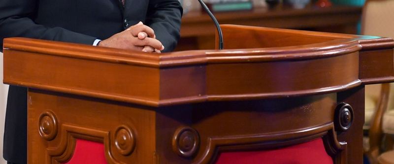 The carved mahogany lectern of the President's Office.